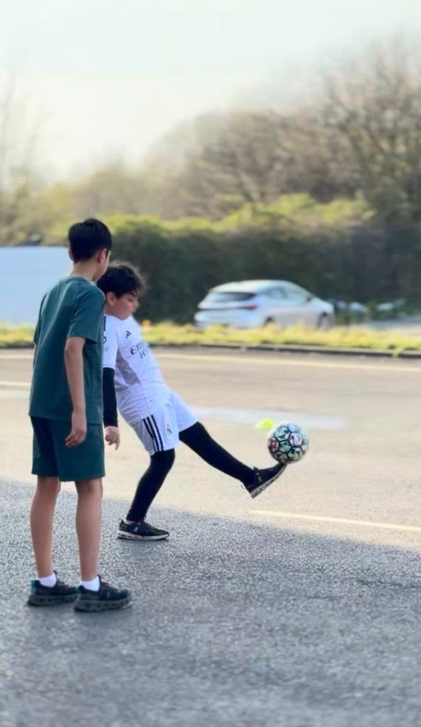 Young players practising football touches outdoors